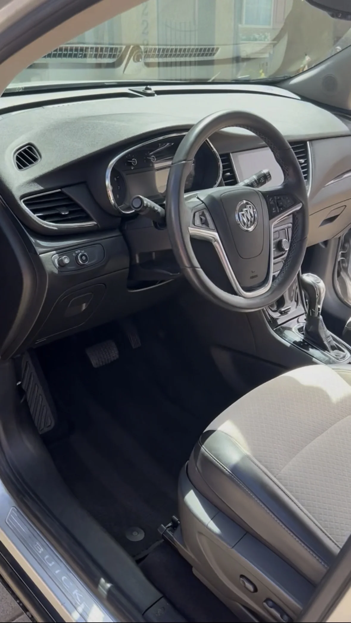 Buick Encore driver's seat and dashboard after a full detail